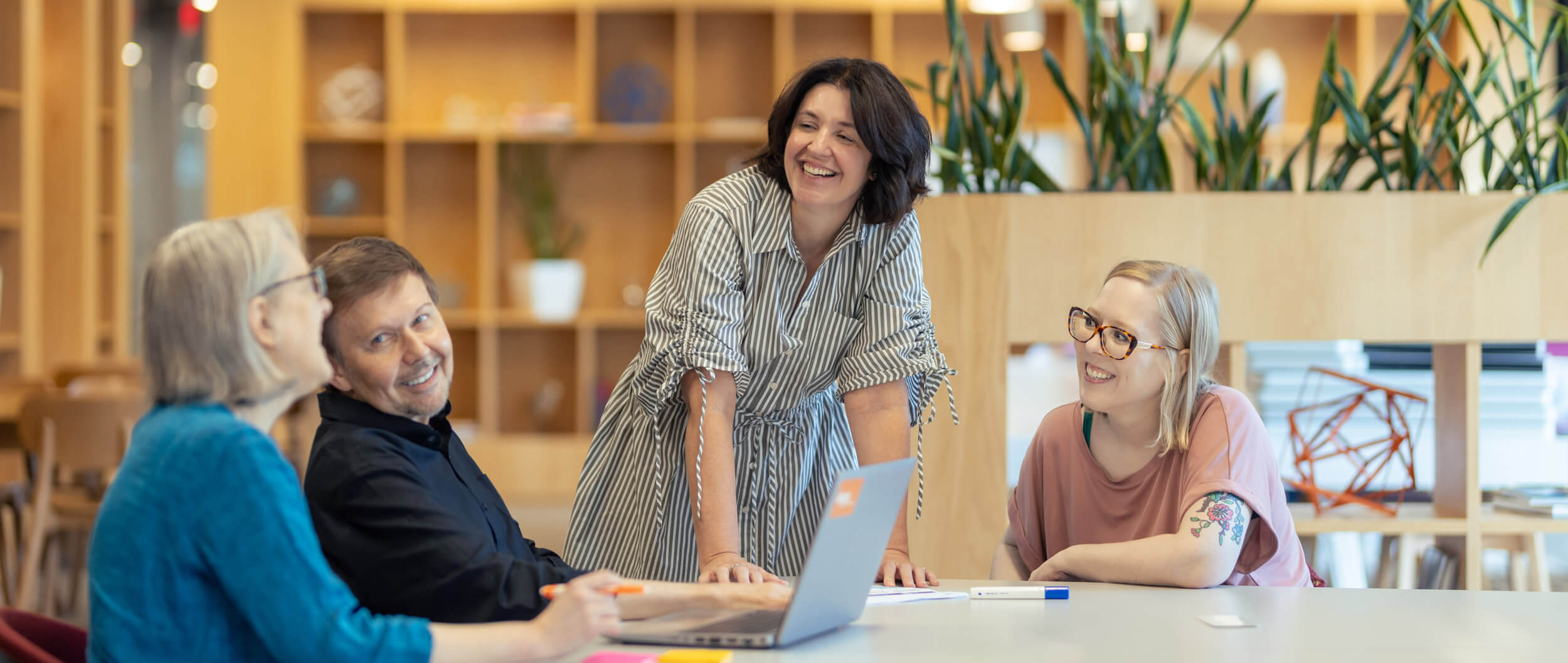 The akoya team working around a conference table.